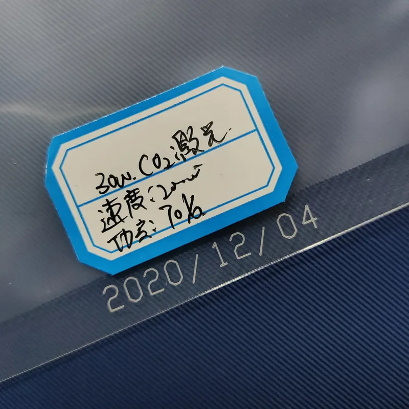 CO2 laser date code on dark packaging material