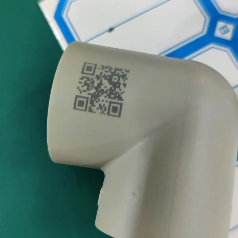 UV laser marking of a QR code on a PPR pipe fitting