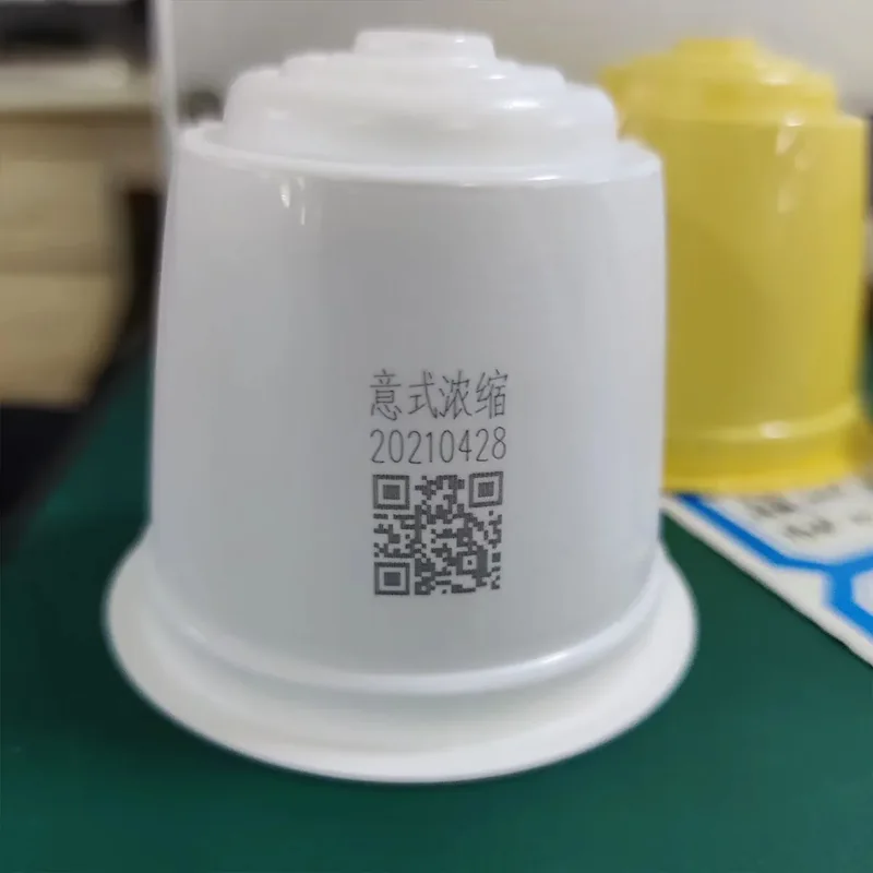 UV laser QR code and text on a white plastic container