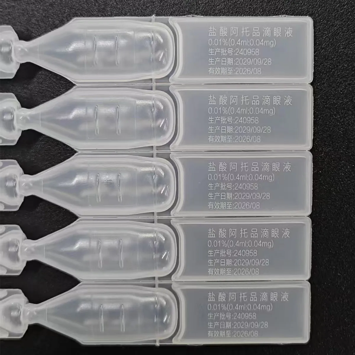 Fine white UV picosecond laser marking on transparent single-dose eye drop containers